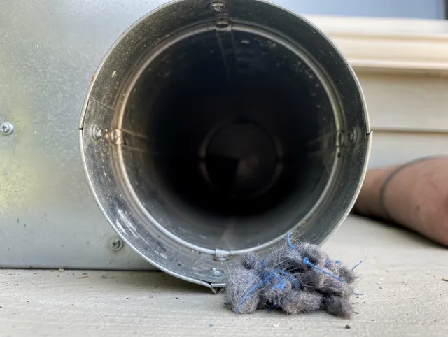 Westchester Dryer Vent Cleaning technician using specialized equipment to clear severe dryer vent blockage in Westchester